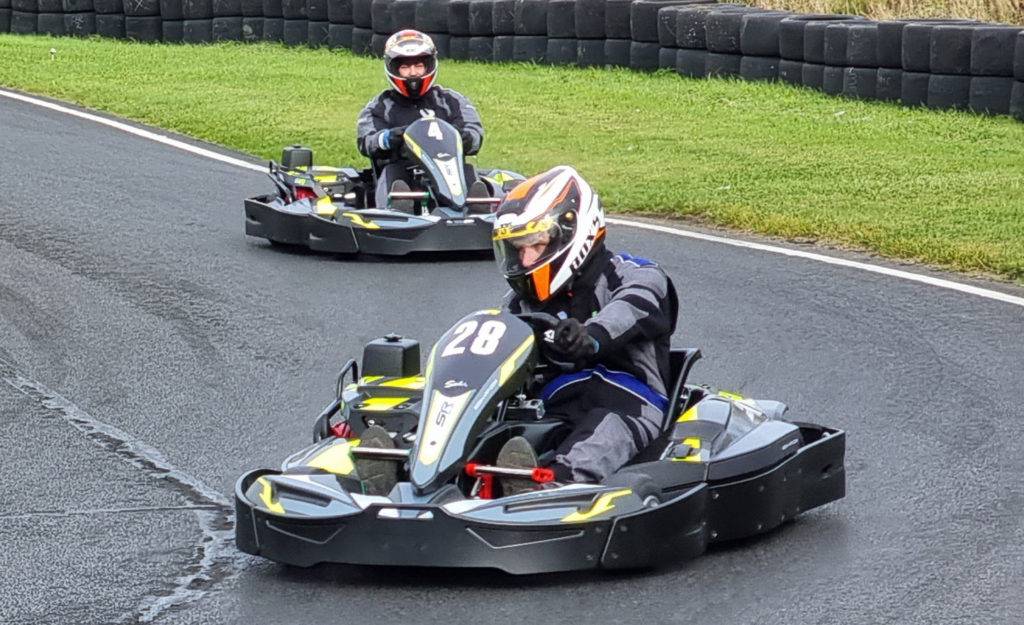 Drivers in timed karting session